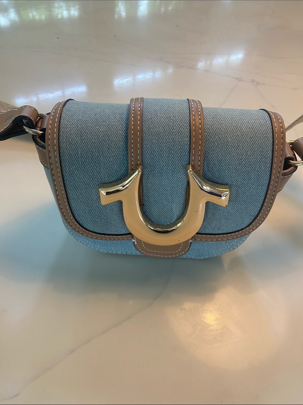 True Religion Light Blue Denim Crossbody with Brown Trim and Gold Accent